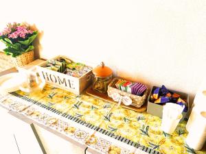 a counter with a bunch of pastries and other snacks at Casale SoleLuna - Bagno condiviso in Sorrezzana +11 photos