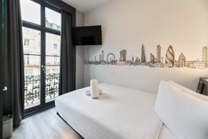 Postel nebo postele na pokoji v ubytování easyHotel Victoria