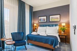 Postel nebo postele na pokoji v ubytování Hotel Diament Plaza Katowice