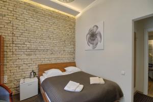 Postel nebo postele na pokoji v ubytování Taurus Apartments Vilnius