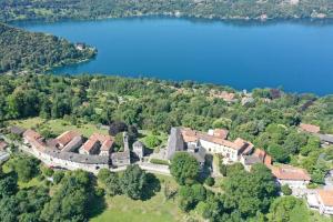 an aerial view of a castle with a lake at La Corte sul lago app Matilde in Ameno