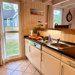 a kitchen with a sink and a counter top at Meeresblume - Baabe in Baabe