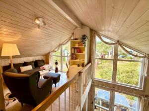 a living room with a couch and a chair at Meeresblume - Baabe in Baabe