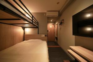 Postel nebo postele na pokoji v ubytování Super Hotel Hiroshima