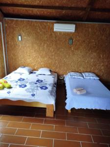 Postel nebo postele na pokoji v ubytování Ferme auberge le Ti'planteur