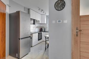Kuchyňa alebo kuchynka v ubytovaní Comfort Apartments Żywiecka