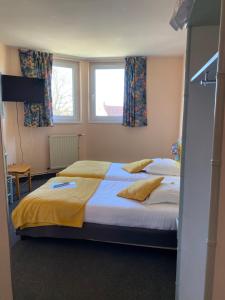 Postel nebo postele na pokoji v ubytování Hotel Le Bellevue
