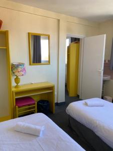 Postel nebo postele na pokoji v ubytování Hotel Le Bellevue