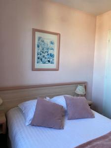 Postel nebo postele na pokoji v ubytování Hotel Le Bellevue