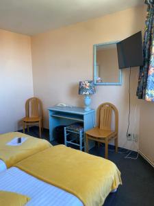 Postel nebo postele na pokoji v ubytování Hotel Le Bellevue