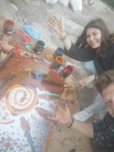 a man and a woman standing in front of a table with a cake at CommunityHostel CoCreation Project in Agulo