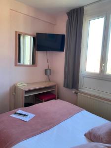 Postel nebo postele na pokoji v ubytování Hotel Le Bellevue
