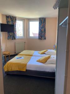 Postel nebo postele na pokoji v ubytování Hotel Le Bellevue