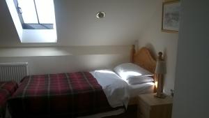 A bed or beds in a room at Old Repeater Station 