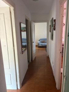 a corridor of a room with a bed and a hallway at Wbs in Almería