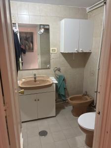 a bathroom with a sink and a toilet at Wbs in Almería