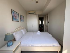 Uma cama ou camas num quarto em Unixx Pattaya High floor view