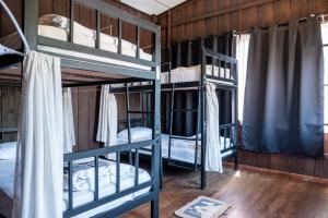 Postel nebo postele na pokoji v ubytování Moon Garden Hostel