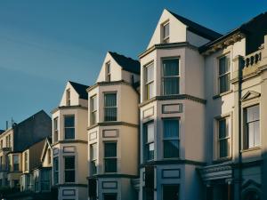 a row of tall buildings on a city street at Portrush Adelphi in Portrush