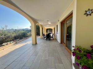 an empty porch with a view of a house at Villa Laura in Pietra Ligure
