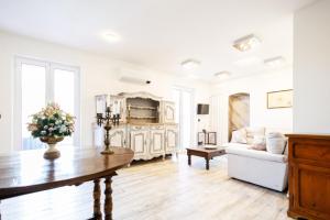 a living room with a table and a couch at Villa Rosa in Camogli +252 photos