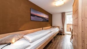 מיטה או מיטות בחדר ב-Appartement Treffpunkt