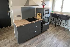 Kuchyňa alebo kuchynka v ubytovaní Appartement - Concarneau