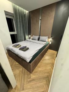 Ένα ή περισσότερα κρεβάτια σε δωμάτιο στο Apartament Plaza Tower 3