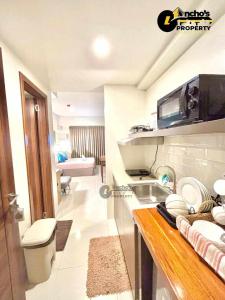 a kitchen with a sink and a toilet in a room at mrbed in Cebu City