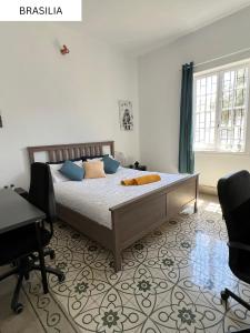 Postel nebo postele na pokoji v ubytování CoLiving Villa Brasil