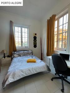 Postel nebo postele na pokoji v ubytování CoLiving Villa Brasil
