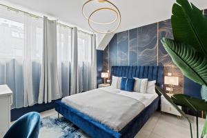 Tempat tidur dalam kamar di Aparthotel Odeon I Self Check In