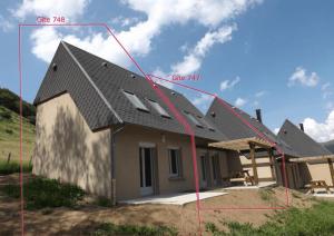 a house with a pitched roof and the parts of it at Gite 14 Séjour Détente au Puy Mary Gîte Équipé avec Terrasse Privative in Le Claux