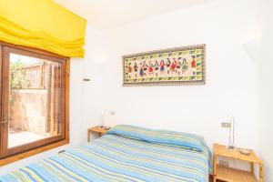 A bed or beds in a room at Flat La Quercia