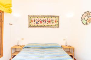 A bed or beds in a room at Flat La Quercia