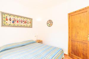 A bed or beds in a room at Flat La Quercia