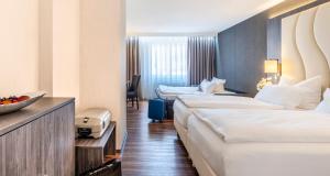 Postel nebo postele na pokoji v ubytování PLAZA Hotel Buchhorner Hof