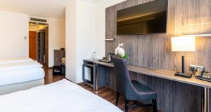 Postel nebo postele na pokoji v ubytování PLAZA Hotel Buchhorner Hof
