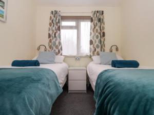 Postel nebo postele na pokoji v ubytování Kenegie Cottage + 19 fotografií