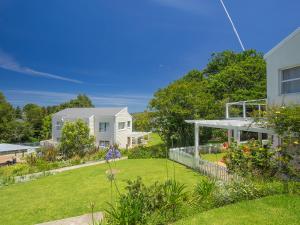 a house with a yard with a garden at Oaklands On The Knoll by Dream Resorts in Knysna