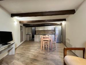 a kitchen and dining room with a table and chairs at Antica Dimora in Catanzaro