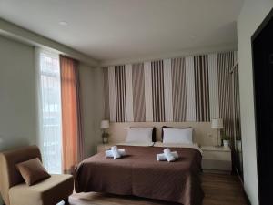 Postel nebo postele na pokoji v ubytování Sani Apart Hotel