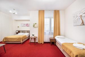 Posteľ alebo postele v izbe v ubytovaní Hotel Arkadia + 30 fotografií