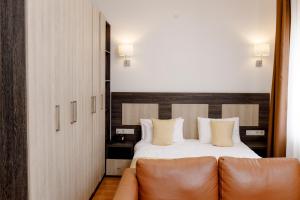 Postel nebo postele na pokoji v ubytování INFINITY PLAZA BLOCK 1