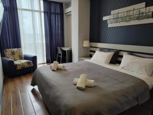 Postel nebo postele na pokoji v ubytování Sani Apart Hotel