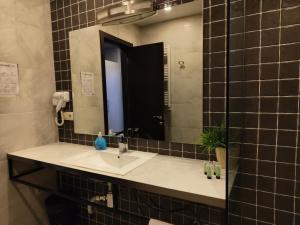 Koupelna v ubytování Sani Apart Hotel