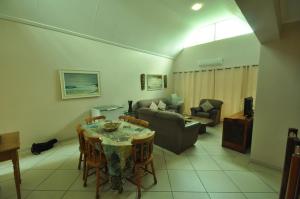 a living room with a table and a couch at The Bridge Apartment, Unit 42 in St Lucia