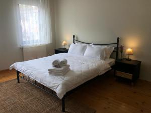 a bedroom with a bed with two teddy bears on it at Utopia Konak Otel in Bozuyuk +29 photos