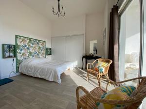 Ένα ή περισσότερα κρεβάτια σε δωμάτιο στο Appartement 6 personnes VUE MER - GRANDE PLAGE