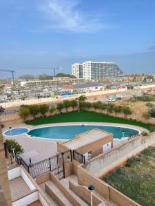 a swimming pool in the middle of a city at Apartamento 3 habitaciones en la playa de Magic World , Oropesa del Mar in Cabanes
